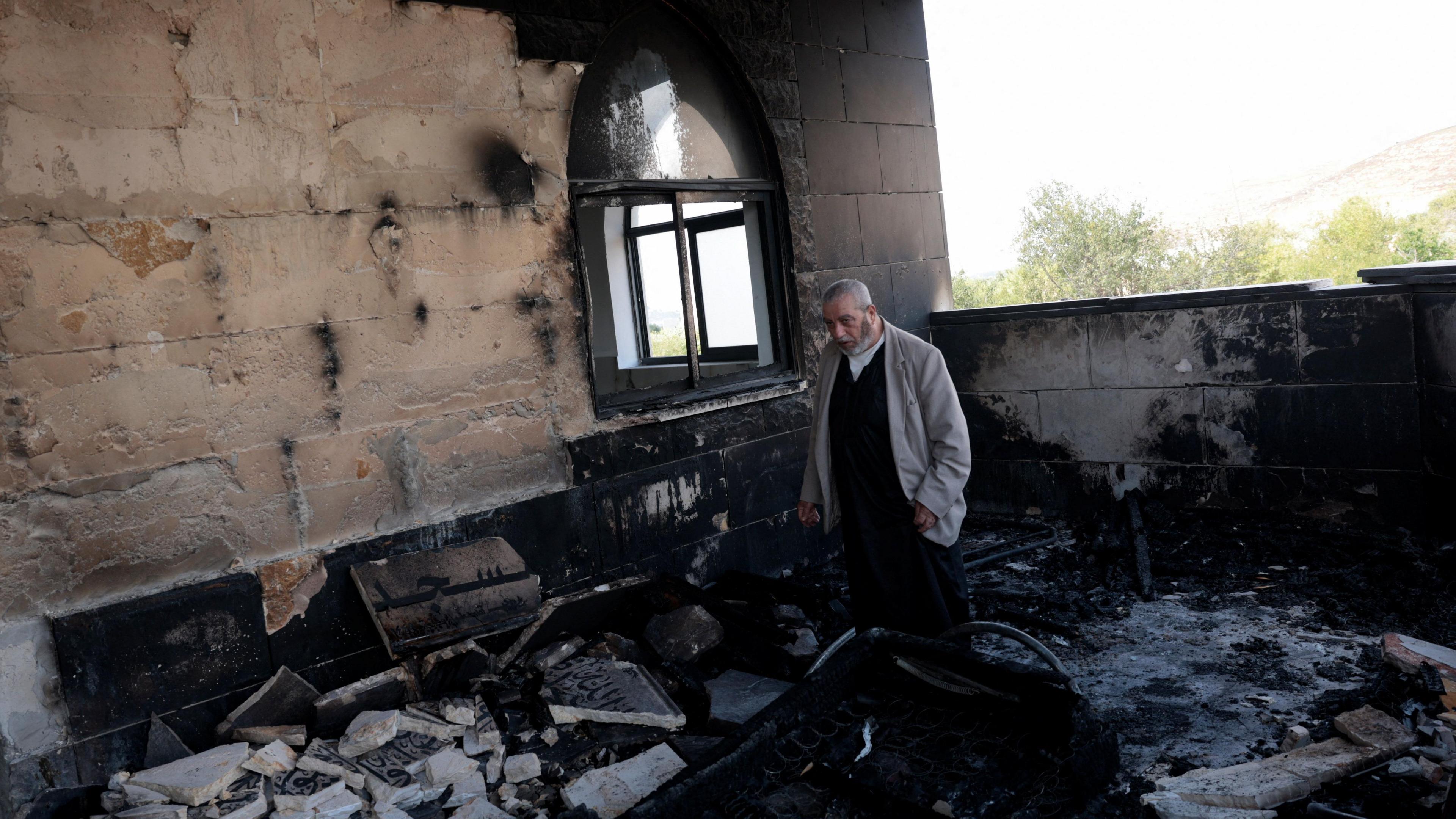 Israeli settlers ignite fire in West Bank villages, targeting mosques and civil property
