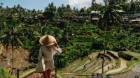 Bali's reputation as a tropical paradise is increasingly overshadowed by the reality of overtourism and environmental challenges, leading to disillusionment for many visitors. Tourists express frustration over their experiences that don't match the picturesque images seen online. Amid floods and urban congestion, local voices highlight the island's cultural richness often missed by visitors focused solely on social media trends.