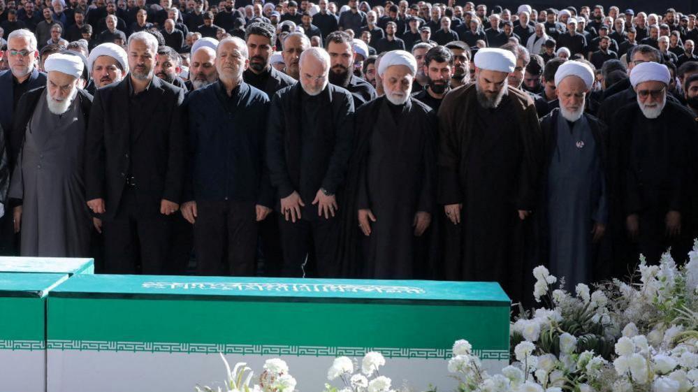 Iran’s Supreme Leader Absence Heats Up Funeral as Thousands Pay Homage