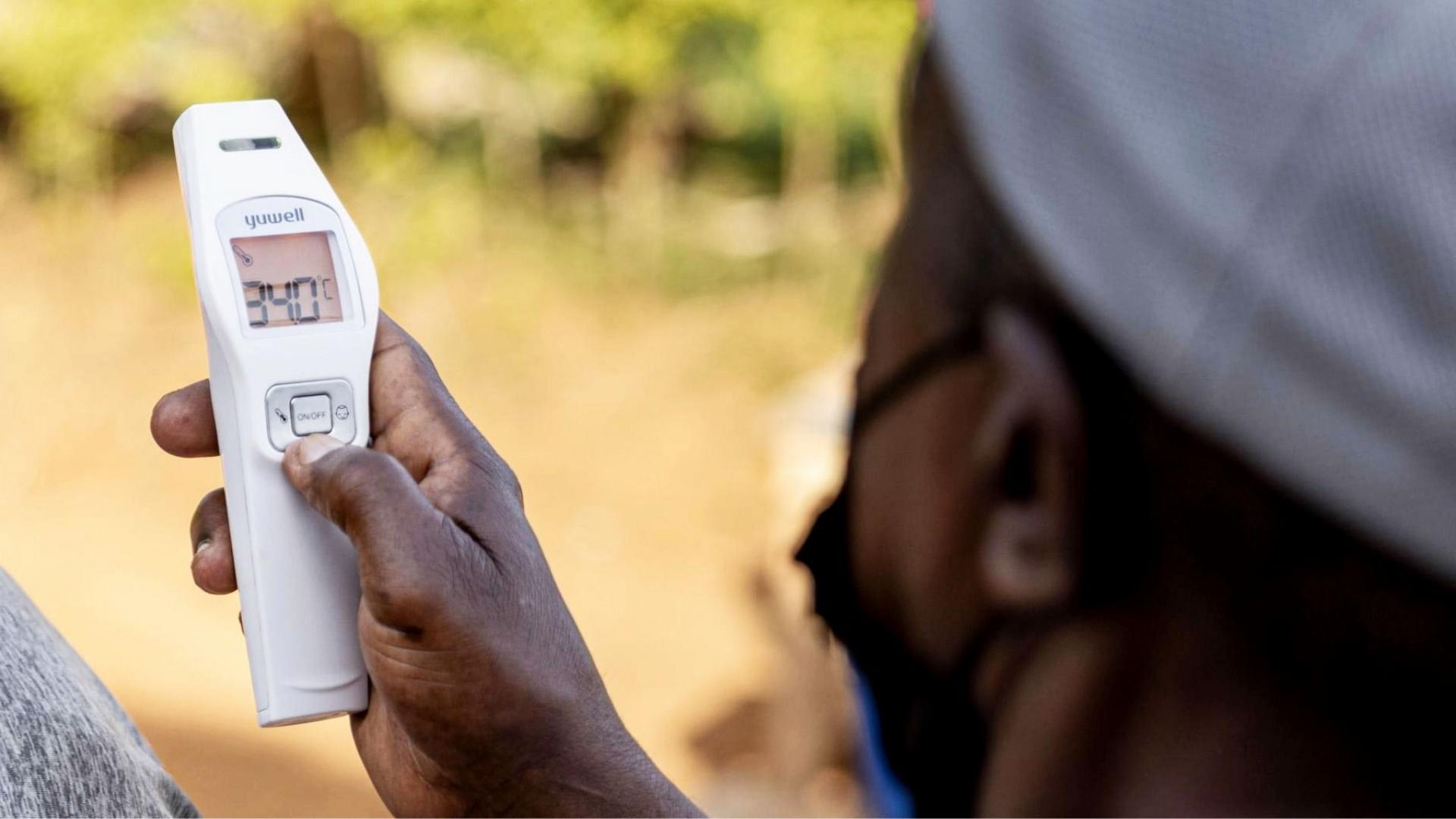 Temperature check by health officials in Nigeria