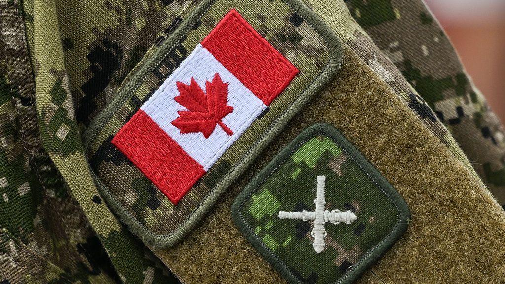 Canadian flag and Royal Regiment of Canadian Artillery insignia on a soldier's sleeve