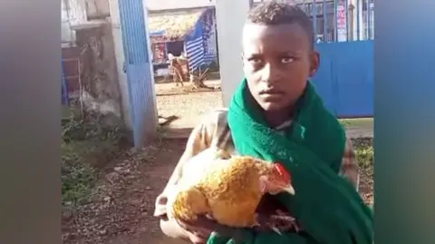 12‑Year‑Old Ethiopian Boy and His Chicken Create Viral Heartwarming Moment