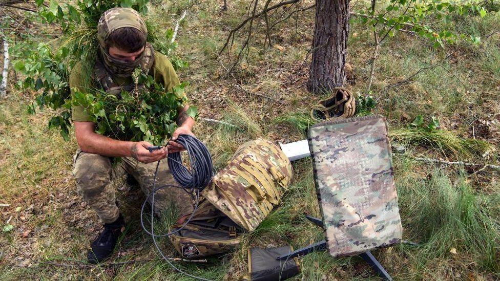 A Ukrainian soldier uses the Starlink system during an exercise in 2023.