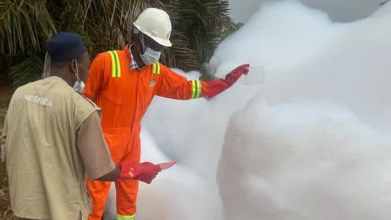 Officials collecting foam on the Kaduna‑Abuja Expressway